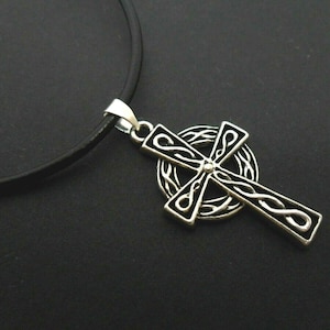 A leather cord 13" - 14" tibetan silver celtic cross charm choker necklace.