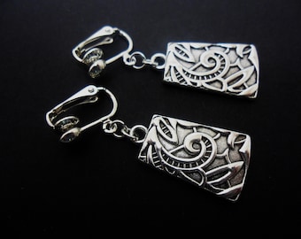 A pair of pretty tibetan silver oblong dangly clip on earrings. New.