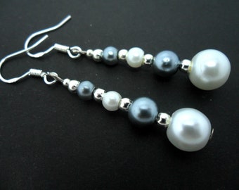 A pair of hand made dangly grey and white glass pearl bead  earrings with 925 solid silver hooks.