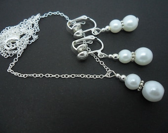 A hand made white glass pearl  necklace and  clip on earring set.