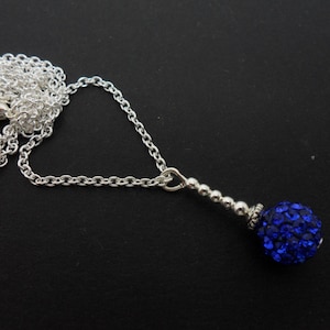 A pretty blue shamballa bead pendant necklace. 18&quot; silver plated chain.