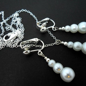 A hand made white glass pearl  necklace and  clip on earring set.