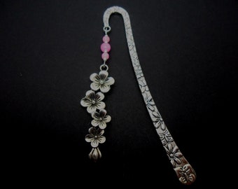 A hand made tibetan silver flower and red jade bead bookmark. New. 12cm long.