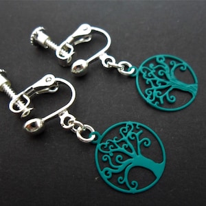 A pair of pretty stainless steel & turquoise blue enamel tree of life dangly screw back clip on earrings.