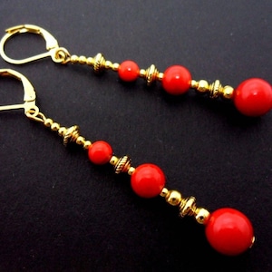 A pair of pretty hand made gold colour red coral bead dangly leverback hook earrings. new.