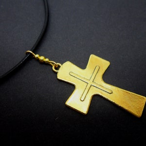 A leather cord 13&quot; - 14&quot; gold colour cross charm choker necklace.