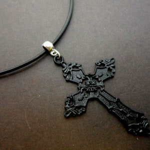 A leather cord 13&quot; - 14&quot; black metal cross crucifix charm choker necklace.