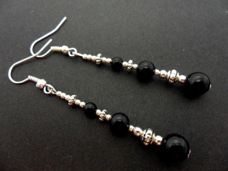 A pair of pretty tibetan silver /& black onyx bead long dangly earrings.