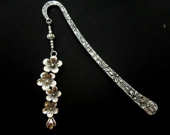 A hand made tibetan silver flower themed bookmark. New. 12cm long.