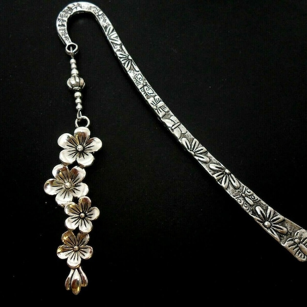 A hand made tibetan silver flower themed bookmark. New. 12cm long.