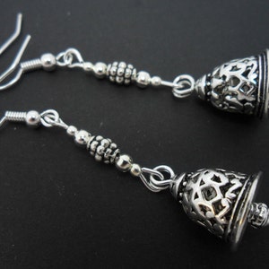 A pair of pretty tibetan silver bell  themed  dangly earrings.
