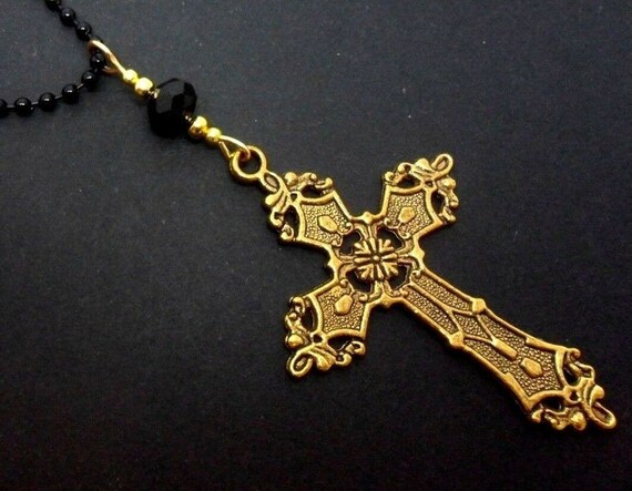 A Lovely Gold Metal Cross and Black Ball Chain Pendant