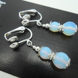 A pair of pretty hand made opalite  dangly clip on earrings.