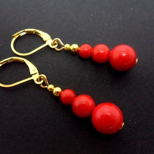 A pair of hand made long dangly gold plated red coral bead leverback hook earrings. New.