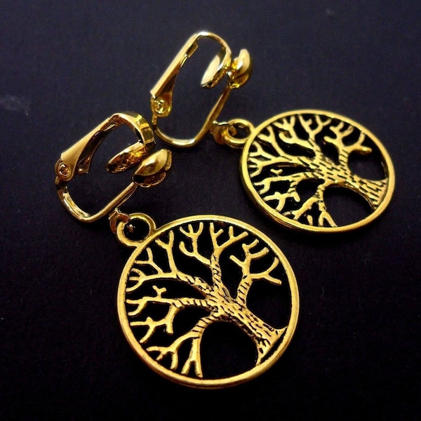 A pair of pretty gold colour tree of life dangly clip on earrings.