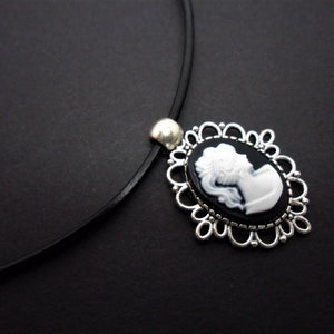 A leather cord 13" - 14" tibetan silver cameo charm choker necklace.