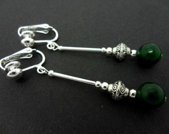 A pair of pretty dark green jade  bead  dangly clip on earrings.