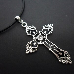A leather cord 13" - 14" tibetan silver cross crucifix charm choker necklace.