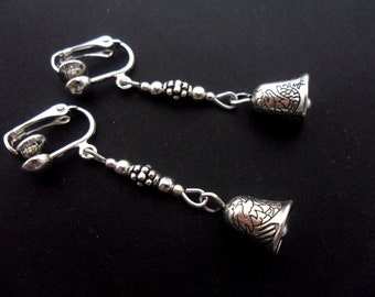 A pair of pretty tibetan silver bell  themed  dangly clip on earrings.