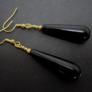 A pair of pretty black onyx bead long dangly teardrop earrings.