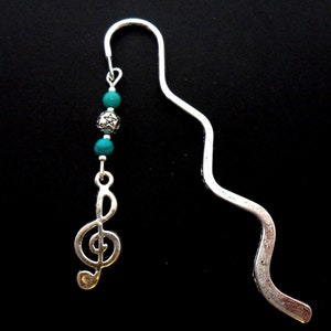 A tibetan silver treble clef musical note and turquoise bead bookmark. 9cm long.