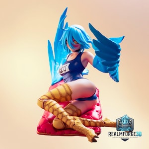 May include: A blue-haired anime-style figure with yellow eyes, wearing a dark blue swimsuit with Japanese text on the chest. The figure has large blue wings, yellow patterned leg coverings, and is seated on a tufted red cushion.