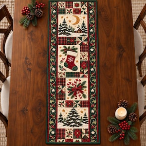 May include: A rectangular quilted table runner featuring a patchwork design with red, green, and cream colors. The runner displays holiday motifs including a Christmas stocking, candy canes, pine trees, and a crescent moon on a cream background.