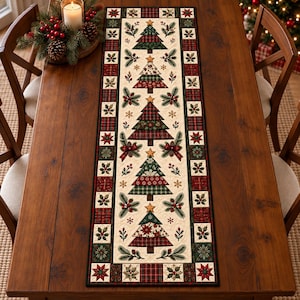 May include: A rectangular table runner featuring a cream-colored center panel decorated with a repeating pattern of Christmas trees, holly sprigs, and gold stars. The border consists of alternating red and green plaid and floral squares.