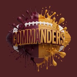May include: A football split vertically into burgundy and gold halves, featuring the word COMMANDERS in bold, raised gold lettering across the centre. The design includes dynamic paint splashes in matching colours radiating outward from the ball.