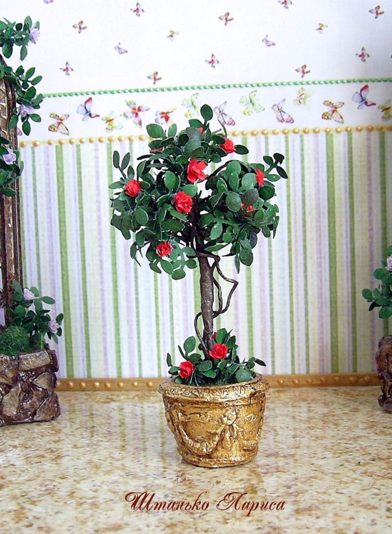 Tree with roses. Realistic plant. Decorative Miniature Tree with