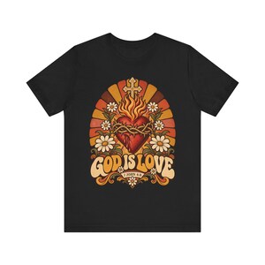 1 John 4:8 Shirt | Catholic T-Shirt | Faith Gift for Women | God Is Love, Retro Sacred Heart Sunburst immagine 7