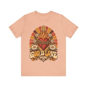 1 John 4:8 Shirt | Catholic T-Shirt | Faith Gift for Women | God Is Love, Retro Sacred Heart Sunburst immagine 3