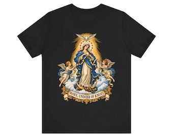 May include: A black short-sleeved t-shirt featuring a graphic print of Mary, Undoer of Knots, depicted with angels, a dove, and a crescent moon. The design includes a golden banner at the bottom with the text MARY, UNDOER OF KNOTS.