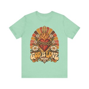 1 John 4:8 Shirt | Catholic T-Shirt | Faith Gift for Women | God Is Love, Retro Sacred Heart Sunburst immagine 4
