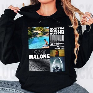 Puede incluir: Una taza de cer&aacute;mica blanca con un asa negra y el texto "But First, Coffee" en negrita negra. La taza est&aacute; llena de un l&iacute;quido oscuro, probablemente caf&eacute;, y se encuentra sobre una superficie clara.