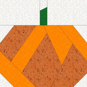May include: A patchwork pumpkin made from orange and brown fabric pieces. The pumpkin has a green stem.