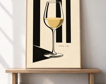 May include: A rectangular wall art print featuring a wine glass filled with golden liquid, set against a cream background with vertical black stripes and a black triangle. The text slow sip is printed in small black letters near the base.