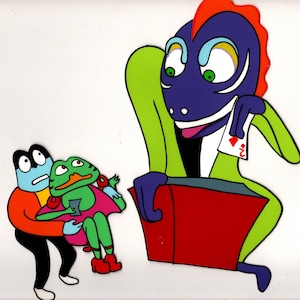 May include: A colorful cartoon animation cel featuring a large purple creature with a red crest holding a playing card with a red diamond. To the left, a small blue character in an orange jacket holds a green frog-like figure in a pink dress.