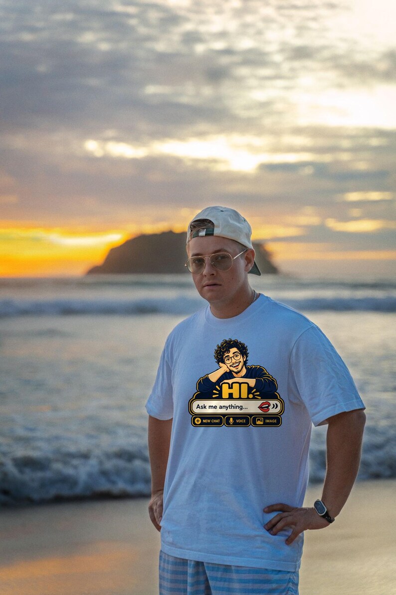 May include: A white short-sleeved t-shirt featuring a graphic of a person with curly hair and glasses resting their chin on their hand. Below the figure is a chat interface box with the text "HI", "Ask me anything...", and icons for new chat, voice, and image.