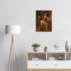 May include: A rectangular wall art print featuring a portrait of a person with dark hair, wearing a patterned orange and red garment, a turquoise necklace, and a headpiece, surrounded by green leaves and orange cacao pods.