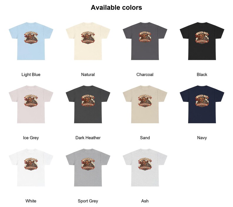 May include: A collection of eleven short-sleeve t-shirts in various colors including light blue, natural, charcoal, black, ice grey, dark heather, sand, navy, white, sport grey, and ash, each featuring a graphic with the text WATCH OUT! I'M ON AUTOPILOT NOW.