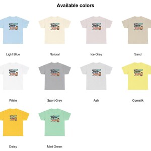 May include: A collection of ten short-sleeve t-shirts in various colors including light blue, natural, ice grey, sand, white, sport grey, ash, cornsilk, daisy, and mint green. Each shirt features a graphic with the text 'you're great from far... far from great' and a small illustration.
