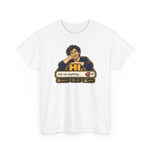 May include: A white t-shirt featuring a graphic of a person with curly hair and glasses leaning on a chat interface. The design includes the text HI, Ask me anything, NEW CHAT, VOICE, and IMAGE, along with a red lip icon and interface buttons.