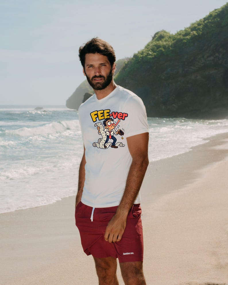May include: A white short-sleeved t-shirt featuring a cartoon graphic of a person with a thermometer in their mouth, holding a long receipt, with the text FEE-ver above. The shirt is paired with solid maroon shorts with a small white logo.