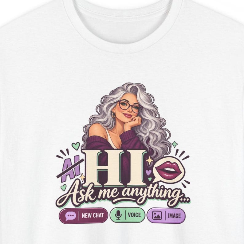 May include: A white t-shirt featuring a graphic of a person with long wavy gray hair and glasses. The text reads HI Ask me anything, with icons for New Chat, Voice, and Image. The design includes small hearts and a speech bubble with lips.