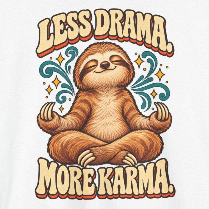 May include: A graphic print featuring a brown sloth sitting in a lotus position with eyes closed. The text "LESS DRAMA." appears above and "MORE KARMA." below in a retro font. Teal swirls and yellow stars surround the sloth.