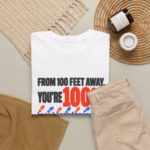 Bold Sarcastic Quote T-Shirt, From 100 Feet Away You're 100%, Funny Gift for Friend, Orange and Black Typography Graphic Tee, Introvert image 5