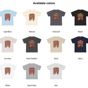 May include: A collection of eleven short-sleeve t-shirts in light blue, natural, charcoal, black, ice grey, dark heather, sand, navy, white, sport grey, and ash, each featuring a graphic of two steaks with the text I AM MEDIUM LOOKING FOR RARE.