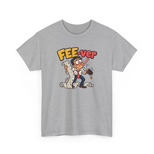 May include: A heather grey t-shirt featuring a cartoon graphic of a sweating person with a thermometer in their mouth, holding a long receipt with dollar signs, and an empty wallet. The text FEE-ver is printed in yellow and red above.