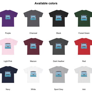 May include: A collection of twelve short-sleeve t-shirts in various colors including purple, charcoal, black, forest green, light pink, maroon, dark heather, red, navy, white, sport grey, and ash, each featuring the text You're so cool I'm freezing.
